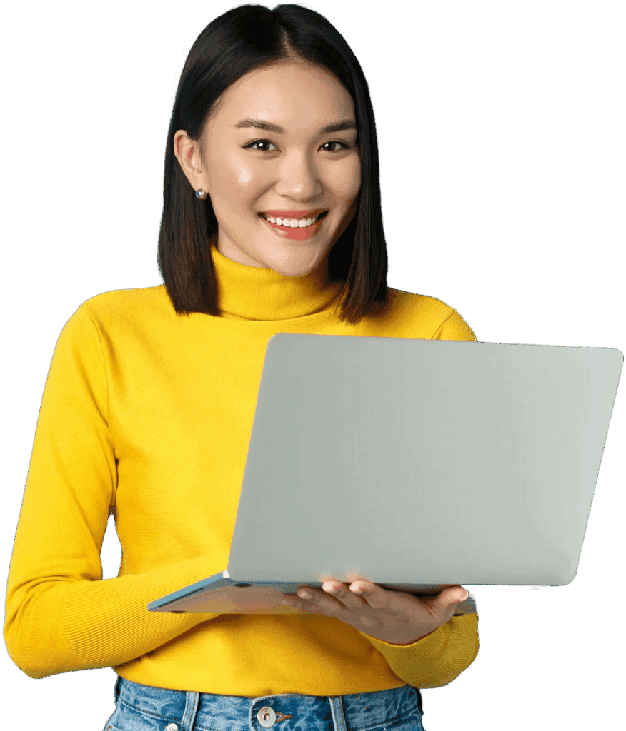 Happy Asian woman in yellow pullover using laptop working