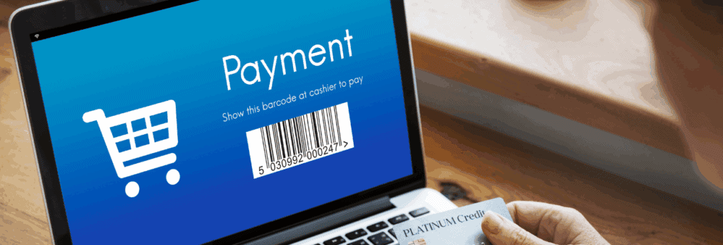 Close-up of a hand holding a card, ready to make a payment