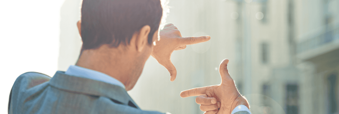 Business man do mesasurement with hand