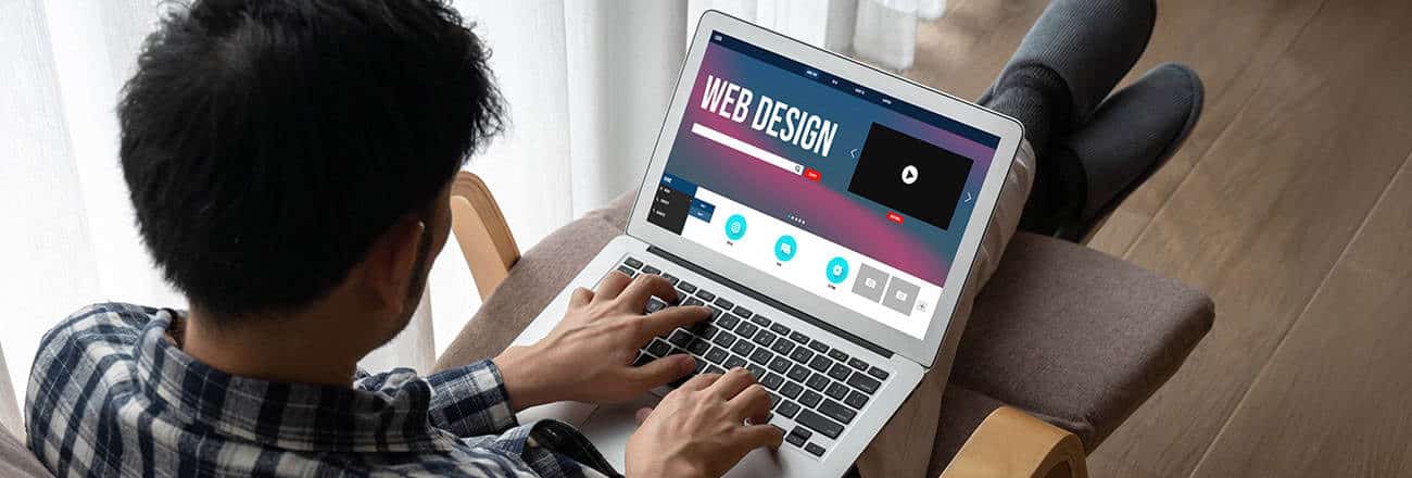 Web designer creating a website layout on screen