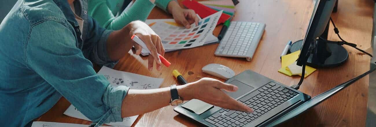 Designer choosing color from color palettes