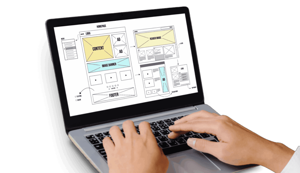 Hands typing on a laptop showing website wireframe mockups